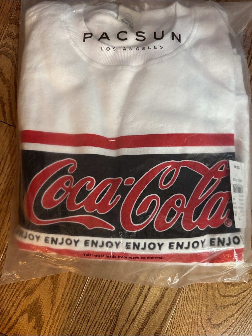 PacSun White Tee with Red & Black Coca-Cola Graphic